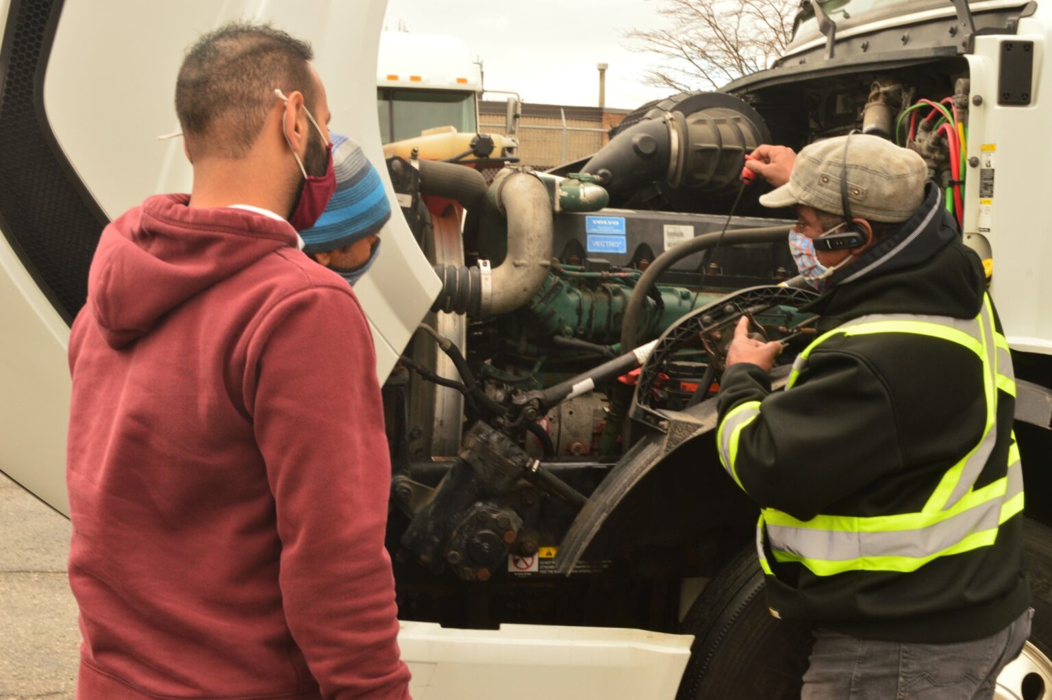 ASE Master Certified technician performing a pre-trip safety inspection at Doc Motor Works in Plainfield, IL.